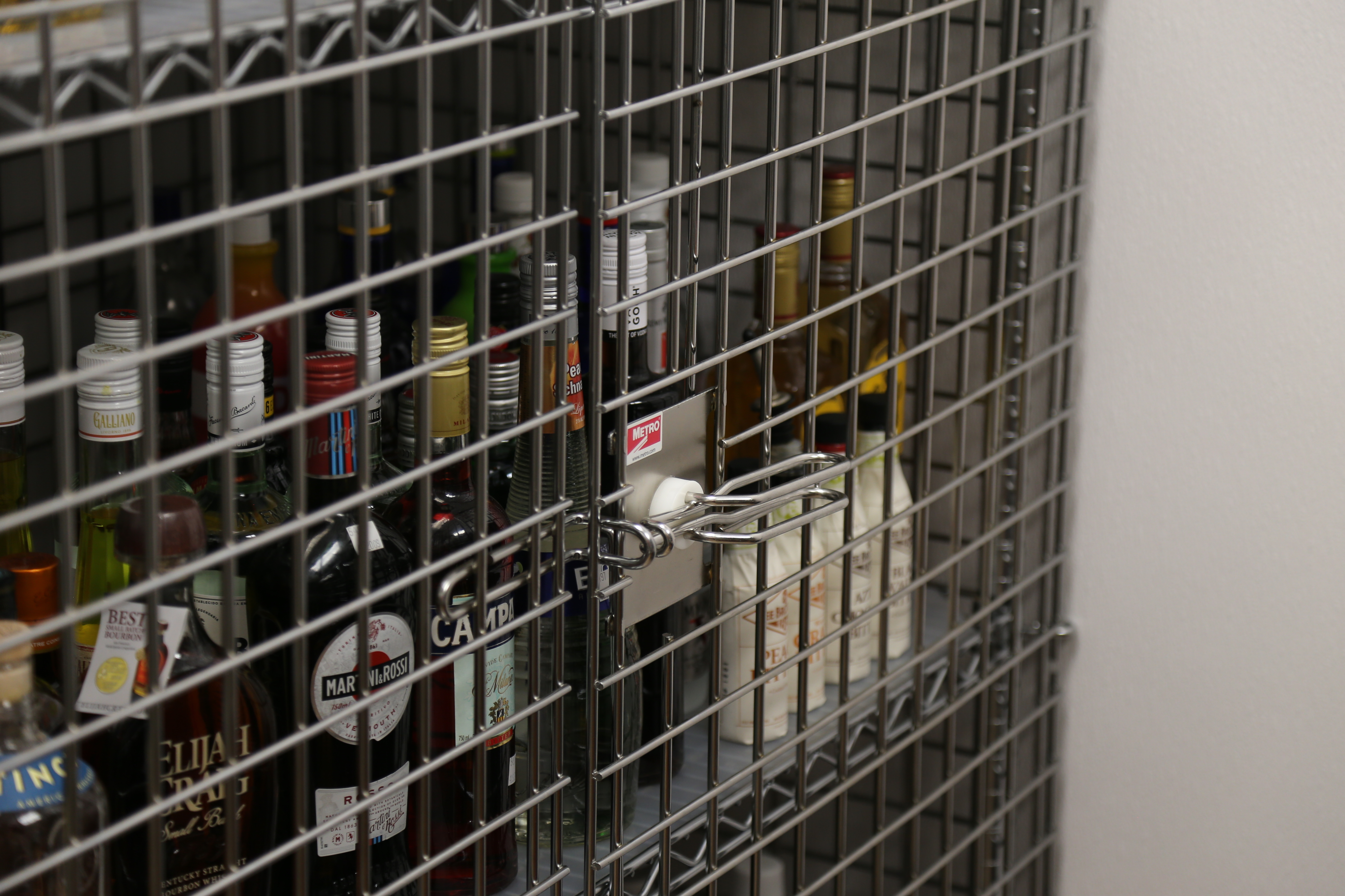 Metro wire security cage filled with alcohol 