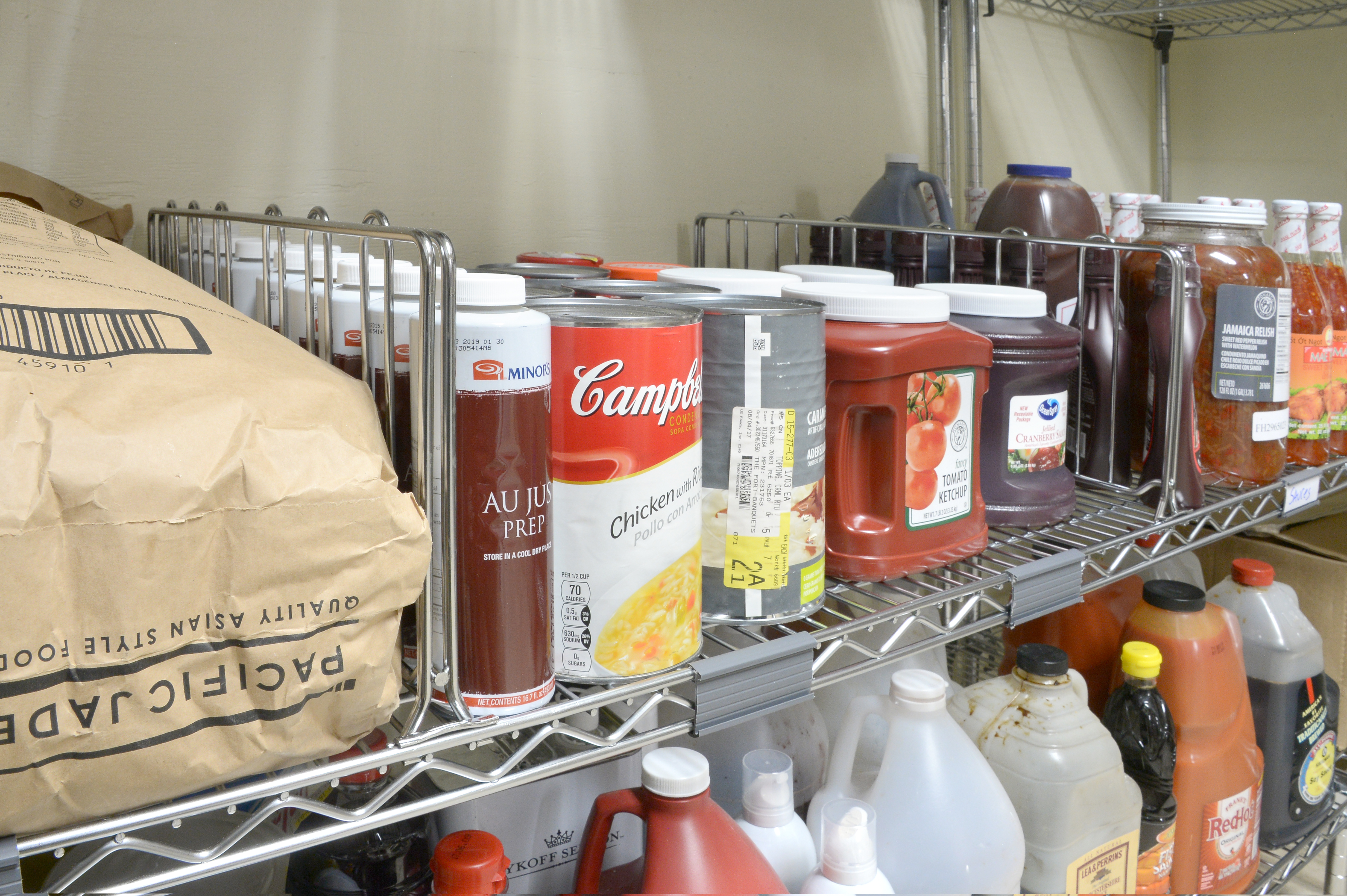 a closeup image of NSF-certified Super Erecta chrome wire shelving used for dry storage in a restaurant 