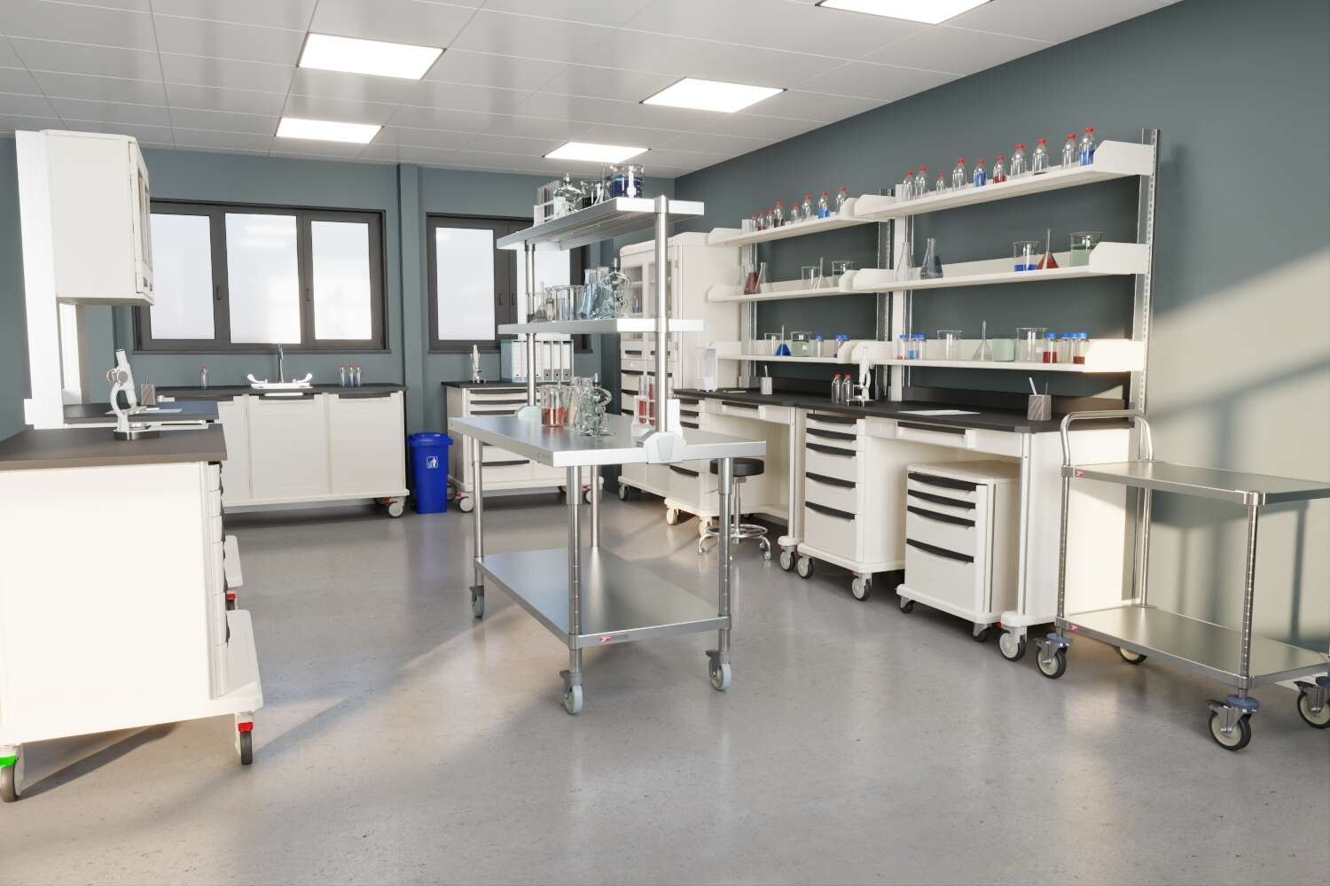 A stainless steel table and utility cart in a laboratory environment